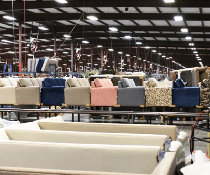 england furniture chairs lined up in assembly line in factory